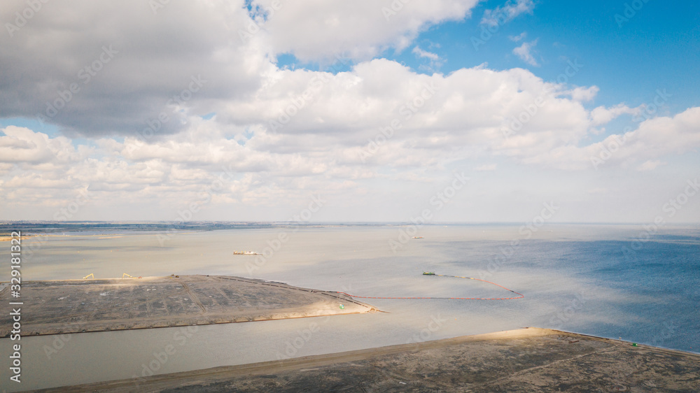 Building of new land in Amsterdam, Holland, the Netherlands by winning water from the Ijmeer lake