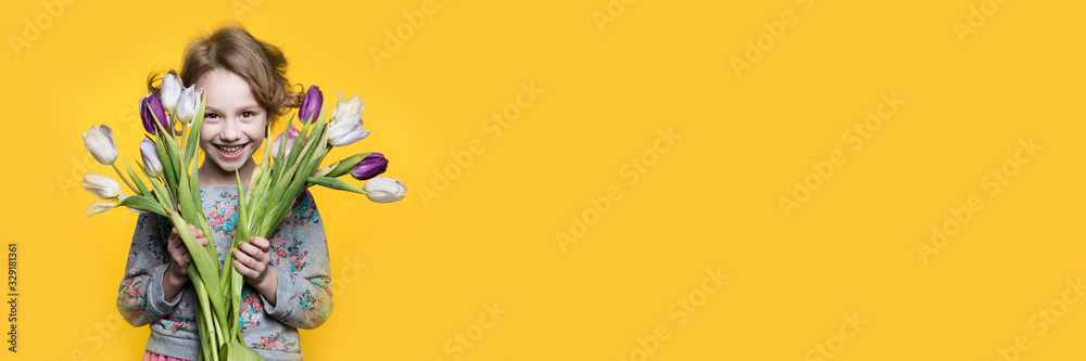 Little girl with a bouquet of tulips. Little girl with a bouquet of tulips.