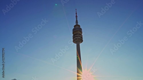 Left to right pan real time establishing shot of the Olympic tower. The Olympic tower is a TV tower in Munich.