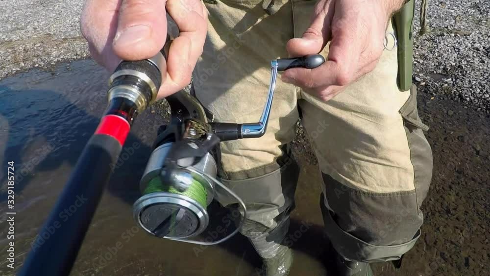 Kamchatka fishing. Fisherman casts spinning fishing lures.
