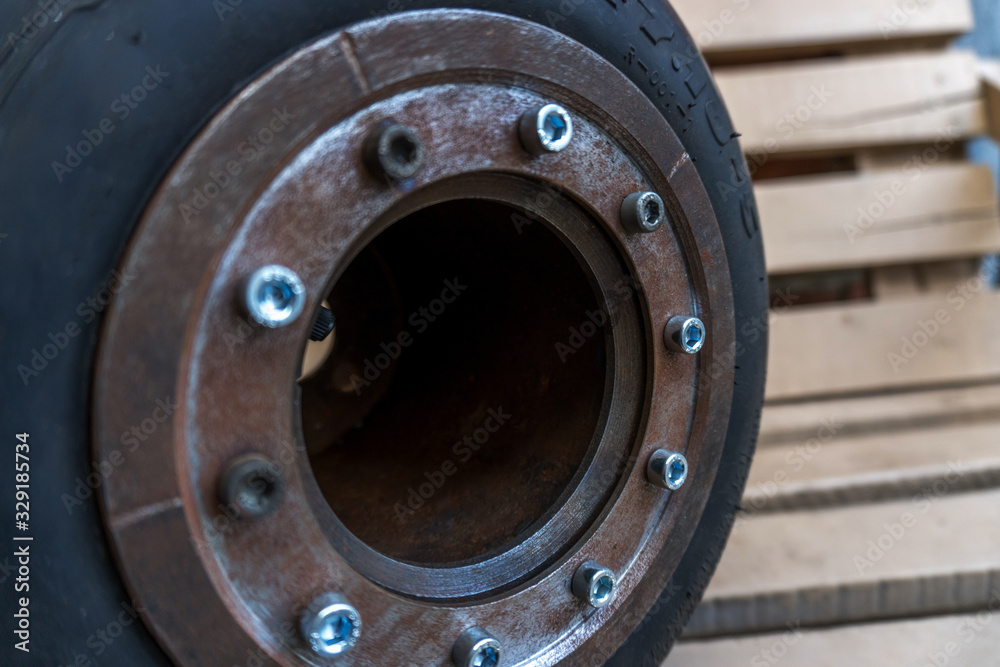 homemade metal disk with a go-kart tire