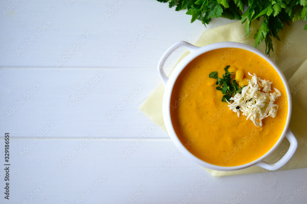 Corn soup with parsley and bread on a white background Corn soup with parsley and bread on a white background