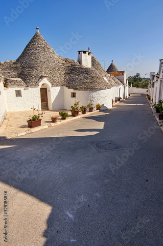 Typical Picturesque Street Displaying The Traditional Trulli houses in Alberobello city  Apulia  Italy