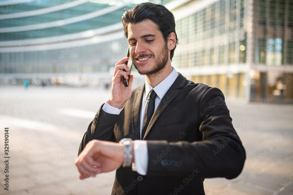 Portrait of a businessman talking on the phone Portrait of a businessman talking on the phone