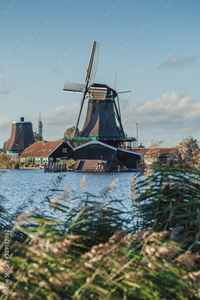 dutch windmill, grass and canal