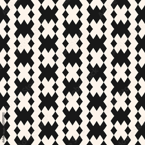 Vector geometric seamless pattern in traditional style. Tribal ethnic motif. Black and white ornament with squares, rhombuses, grid, mesh, lattice. Abstract monochrome texture.  Repeatable background