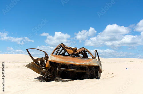 Burnt out car in the desert