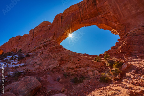The Sun Shines Through the North Window Arch in Arches National Park