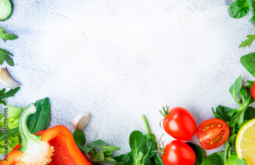 Healthy food background with various green herbs and vegetables. Ingredients for cooking salad. Vegetarian and vegan food concept. Top view, copy space