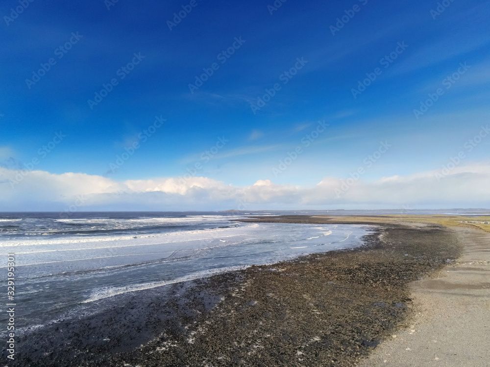 Atlantic ocean, Strandhill beach, Aerial view, Cloudy sky, sunny day, Powerful waves in the ocean, county Sligo Ireland. Atlantic ocean, Strandhill beach, Aerial view, Cloudy sky, sunny day, Powerful waves in the ocean, county Sligo Ireland.