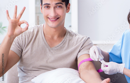 Patient getting blood transfusion in hospital clinic