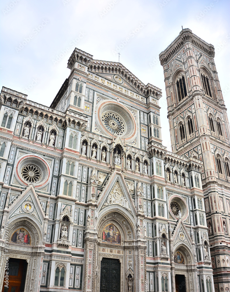 Basilica del Santa Maria del Fiore and Companile di Giotto, Bell Tower on Piazza del Duomo in Florence, Italy;.front marble facade