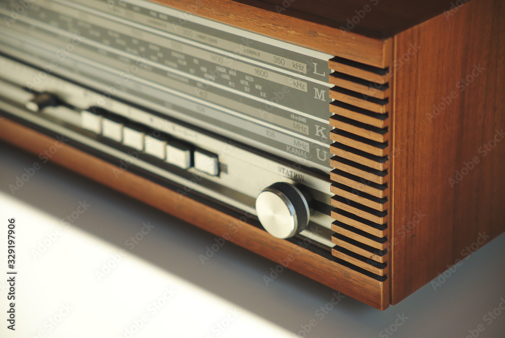 Fototapeta premium Old vintage radio In wooden case, retro style. Close up.
