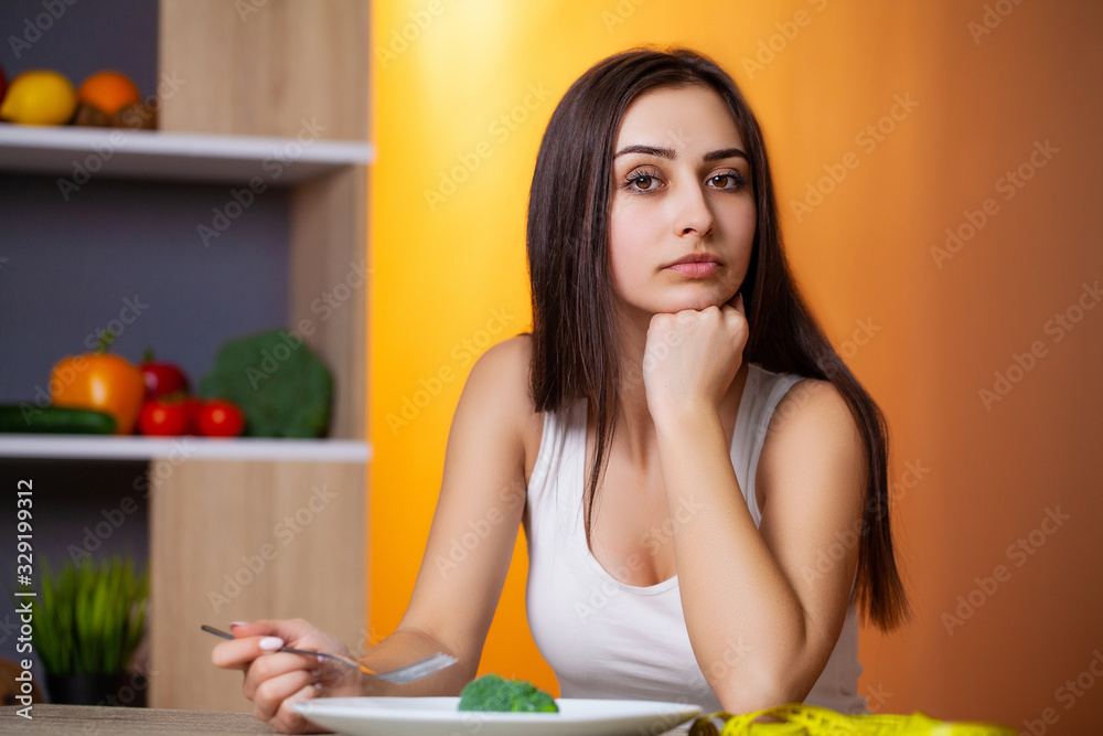 Portrait of young beautiful girl adhering to diet regime Portrait of young beautiful girl adhering to diet regime