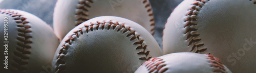 Baseballs close up shows texture of seams for sports banner