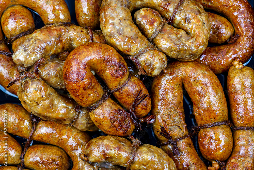 Homemade fried pork sausages in the form of rings. Texture Homemade fried pork sausages in the form of rings. Texture