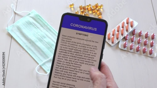 Woman hands reading COVID-19 disease advices on phone, people informing itself Sars-CoV-2 spread, adult finding out Coronavirus 2019-nCoV epidemic on mobile about symptoms and protective measures
