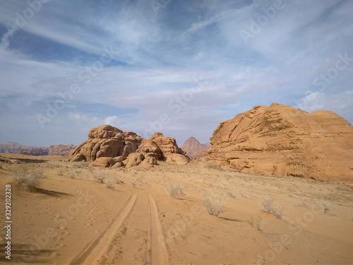 car tracks and desert landscape of Wadi Rum desert in southern Jordan. 