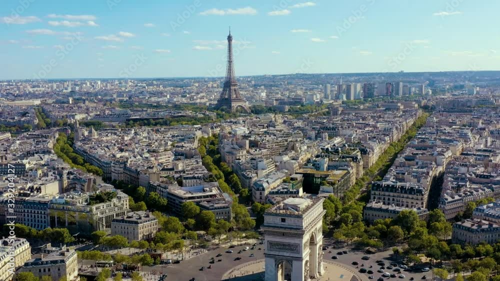 PARIS, FRANCE - MAY, 2019: Aerial drone view of Triumphal Arch and and Eiffel tower in historical city centre.