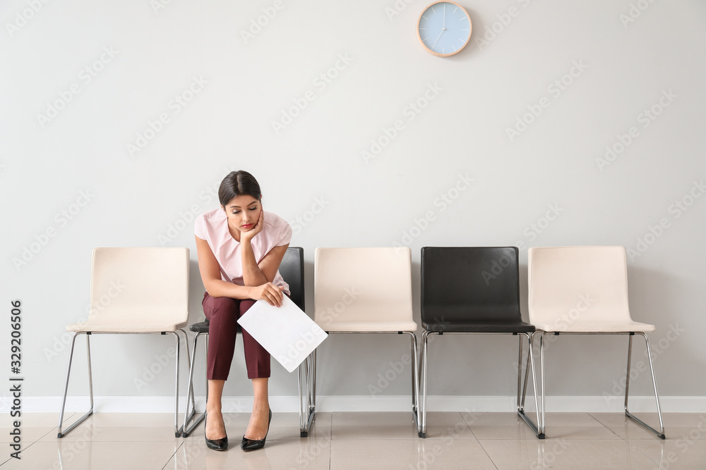 Young woman waiting for job interview indoors Young woman waiting for job interview indoors