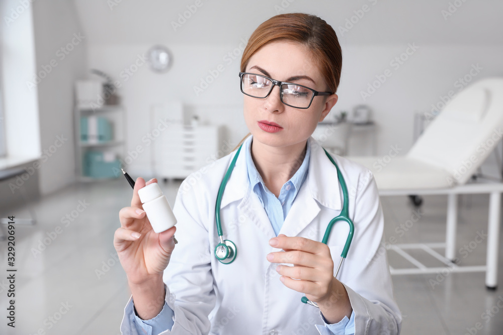 Female doctor using video chat in clinic Female doctor using video chat in clinic