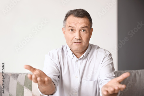 Mature man using video chat...