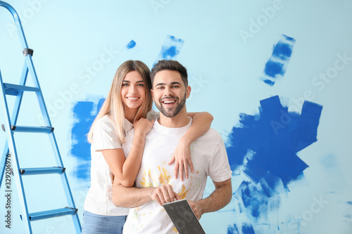 Happy young couple doing re...
