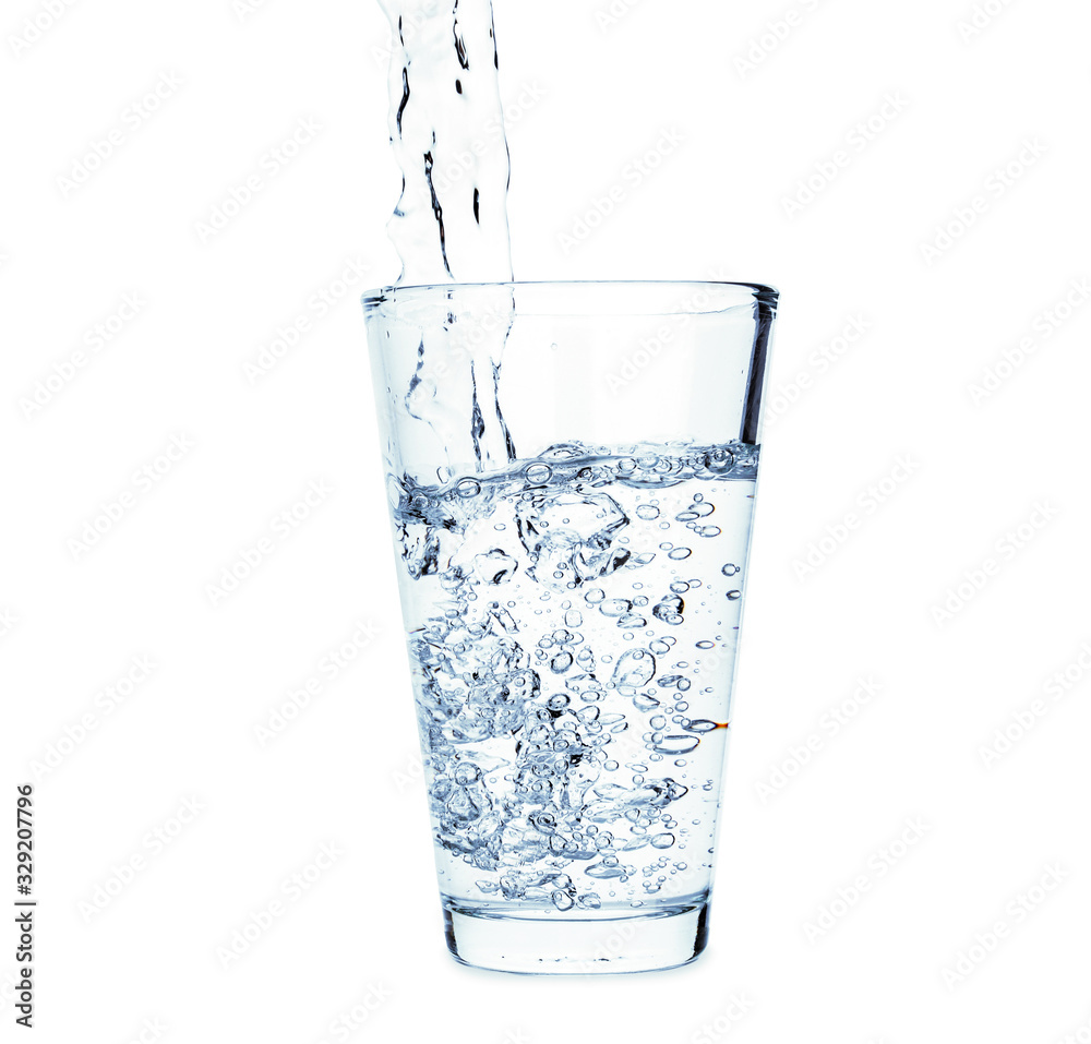Pouring of fresh water in glass on white background Pouring of fresh water in glass on white background