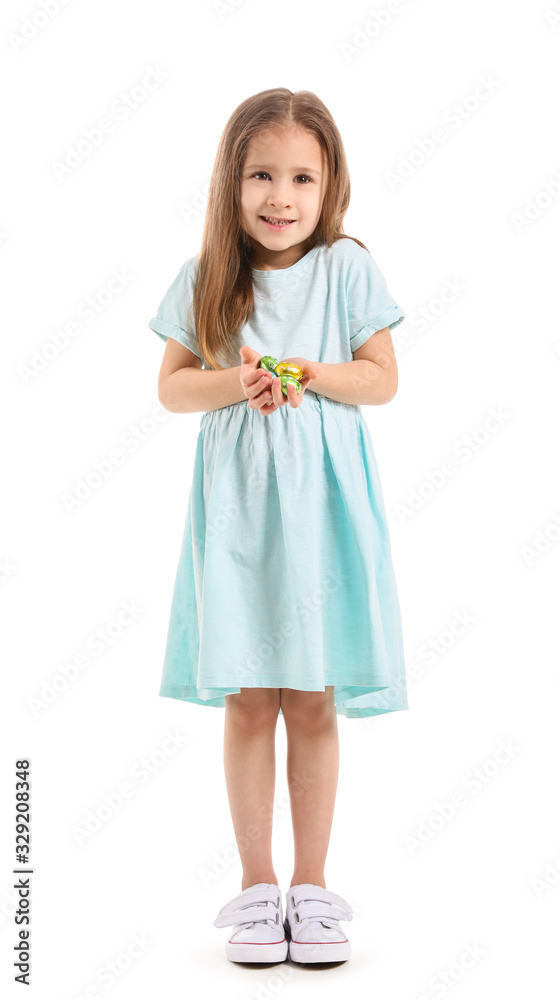 Cute little girl with sweet chocolate eggs on white background Cute little girl with sweet chocolate eggs on white background