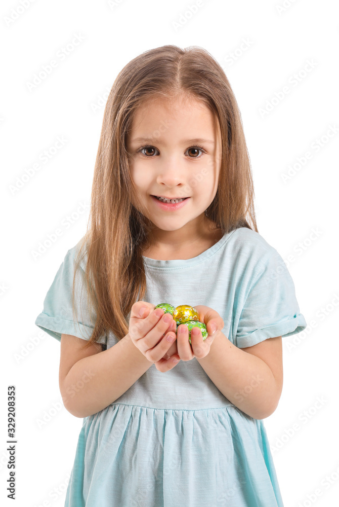 Cute little girl with sweet chocolate eggs on white background Cute little girl with sweet chocolate eggs on white background