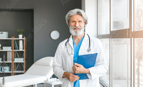 Portrait of senior male doc...