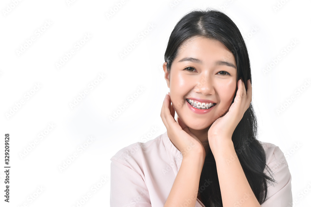 Asian woman poses for healthy skin beauty with fresh, big smile and healthy face in white isolated background. Cosmetic, skincare, surgery concept with copy space. Asian woman poses for healthy skin beauty with fresh, big smile and healthy face in white isolated background. Cosmetic, skincare, surgery concept with copy space.