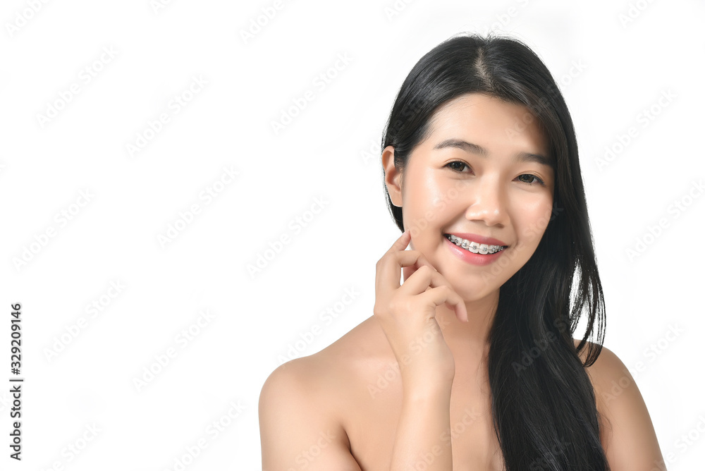 Asian woman poses for healthy skin beauty with fresh, big smile and healthy face in white isolated background. Cosmetic, skincare, surgery concept with copy space. Asian woman poses for healthy skin beauty with fresh, big smile and healthy face in white isolated background. Cosmetic, skincare, surgery concept with copy space.