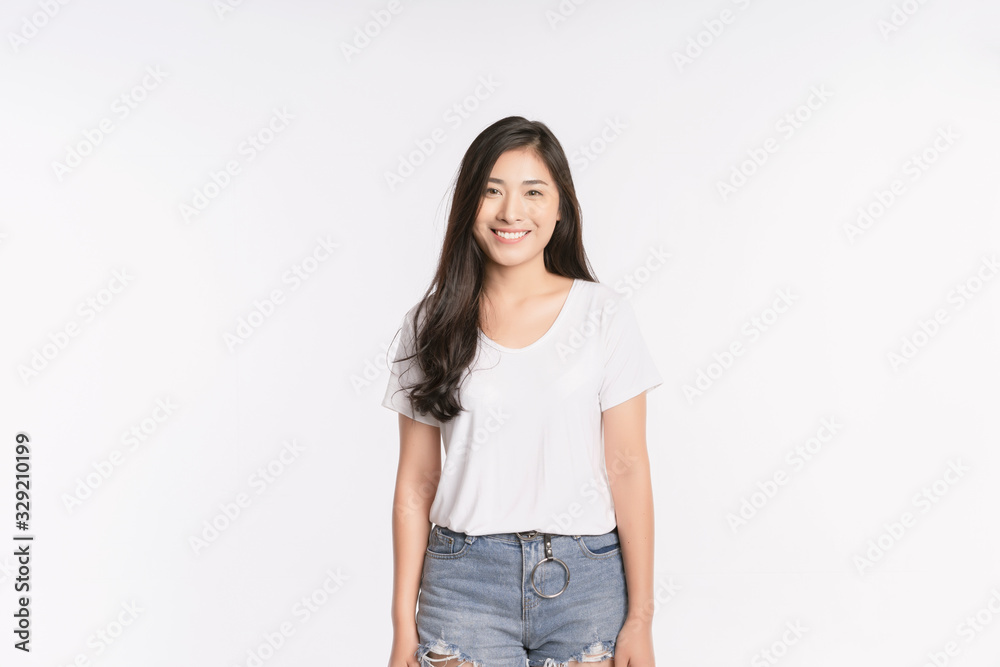 Young Asian girl Smiling, woman Portrait isolated on white background. The lady in a summer t-shirt Short jeans. Copy space Young Asian girl Smiling, woman Portrait isolated on white background. The lady in a summer t-shirt Short jeans. Copy space