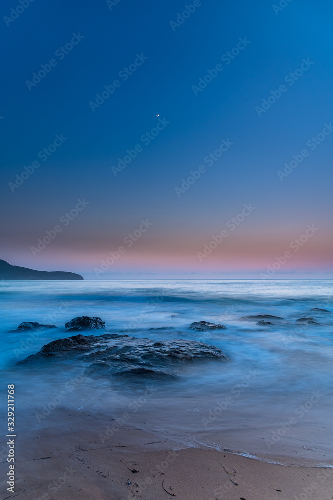 Naklejka premium Iridescent Blue Dawn Seascape with Crescent Moon
