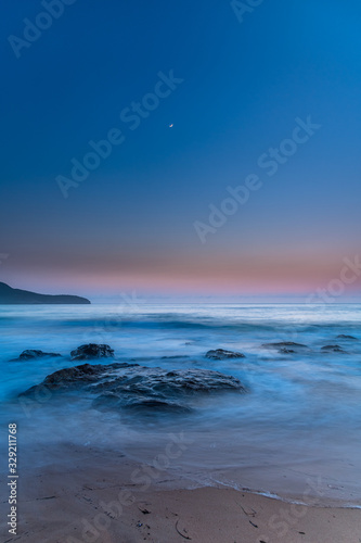 Iridescent Blue Dawn Seascape with Crescent Moon © Merrillie
