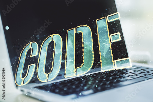 Creative Code word sign on modern computer background, international software development concept. Multiexposure photo