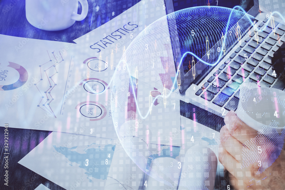 Double exposure of stock graph with businessman typing on computer in office on background. Concept of hard work. Double exposure of stock graph with businessman typing on computer in office on background. Concept of hard work.
