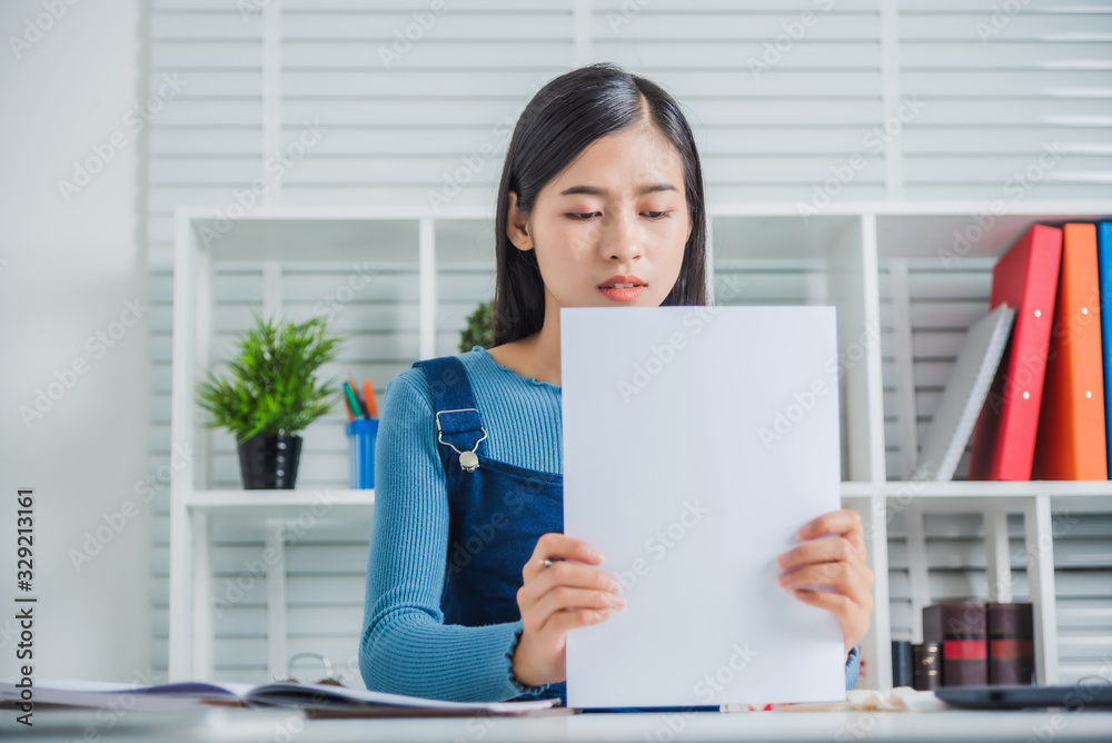 Young attractive asian female tried business housing bills to her son expenses. Young attractive asian female tried business housing bills to her son expenses.
