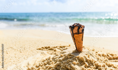 Photography Ice cream cone on sand beach background - Melting ice cream on beach sea in summ