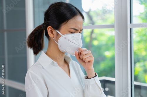 Woman wearing face mask protect from germs or viruses in the air.