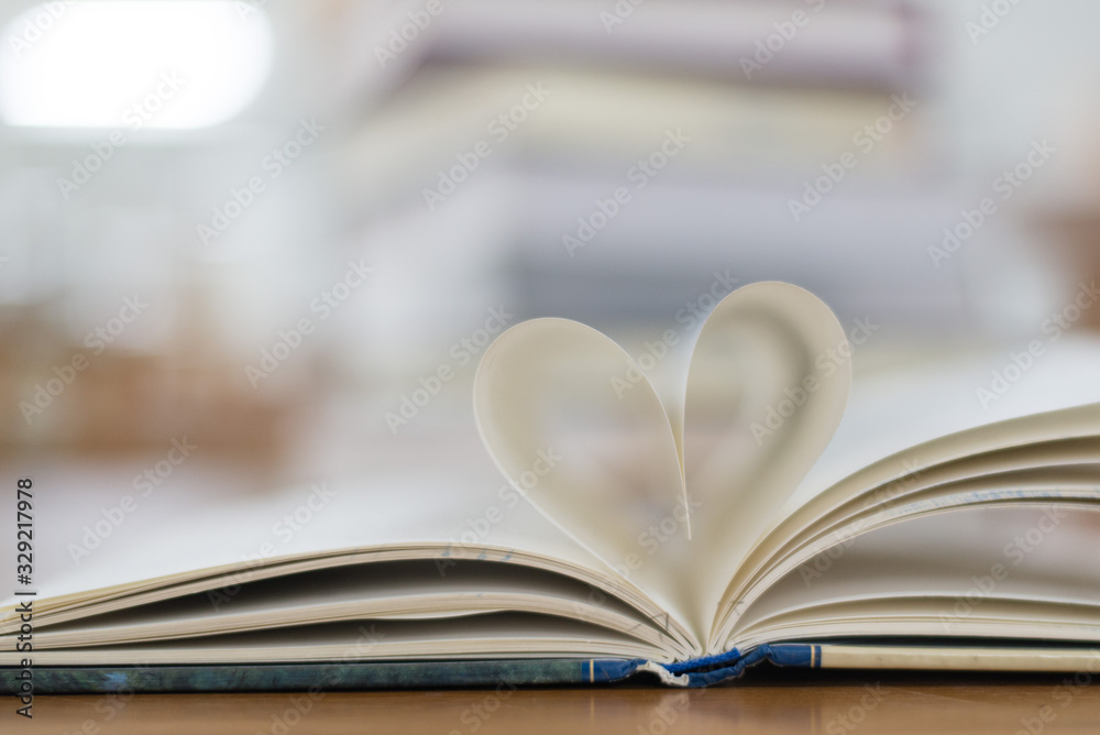Fototapeta premium Open the book to make the heart image