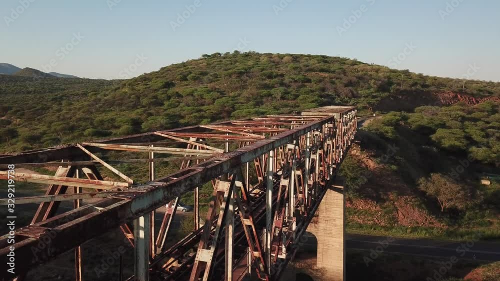 4K aerial drone video view of historical railway bridge on main B6 road from Windhoek to Gobabis and Windhoek Hosea Kutako Airport in central highland Khomas Hochland of Namibia, southern Afric 4K aerial drone video view of historical railway bridge on main B6 road from Windhoek to Gobabis and Windhoek Hosea Kutako Airport in central highland Khomas Hochland of Namibia, southern Afric
