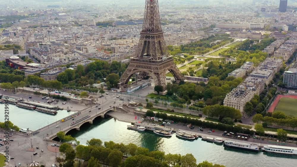 PARIS, FRANCE - MAY, 2019: Aerial drone view of Eiffel tower and Seine river in historical city centre from above.