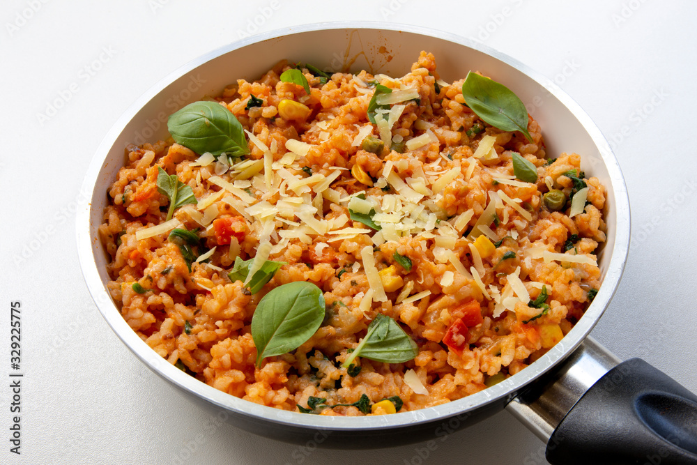Risotto with tomatoes, fresh herbs and parmesan cheese Risotto with tomatoes, fresh herbs and parmesan cheese