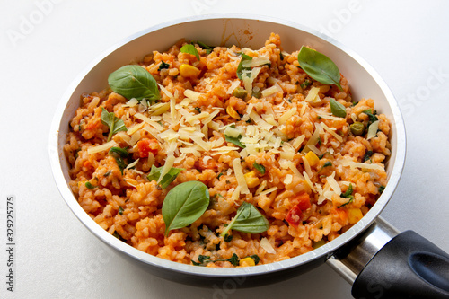 Risotto with tomatoes, fresh herbs and parmesan cheese