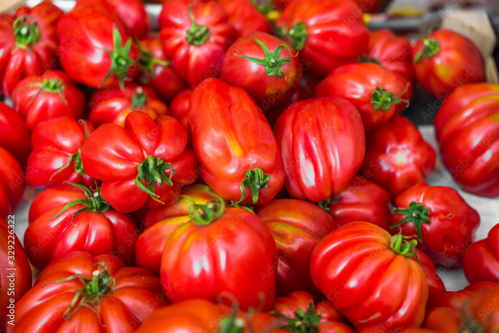 Close up food photo of organic tomatoes at the farmers market stall Close up food photo of organic tomatoes at the farmers market stall