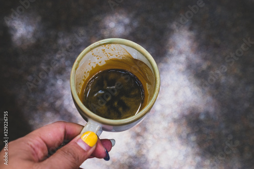 Cup of espresso coffee on wood background vintage tone, shot from above shallow depth of field