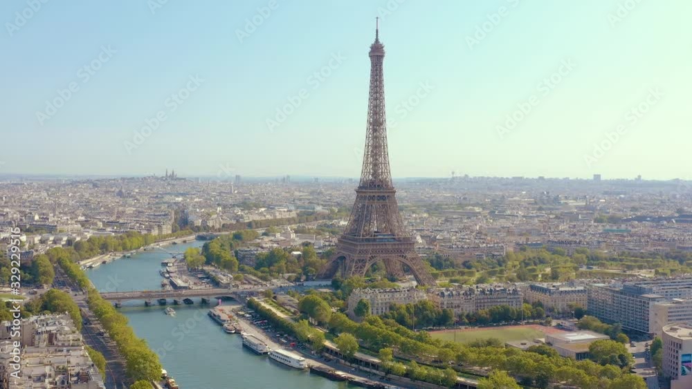 PARIS, FRANCE - MAY, 2019: Aerial drone view of Eiffel tower and Seine river in historical city centre from above.