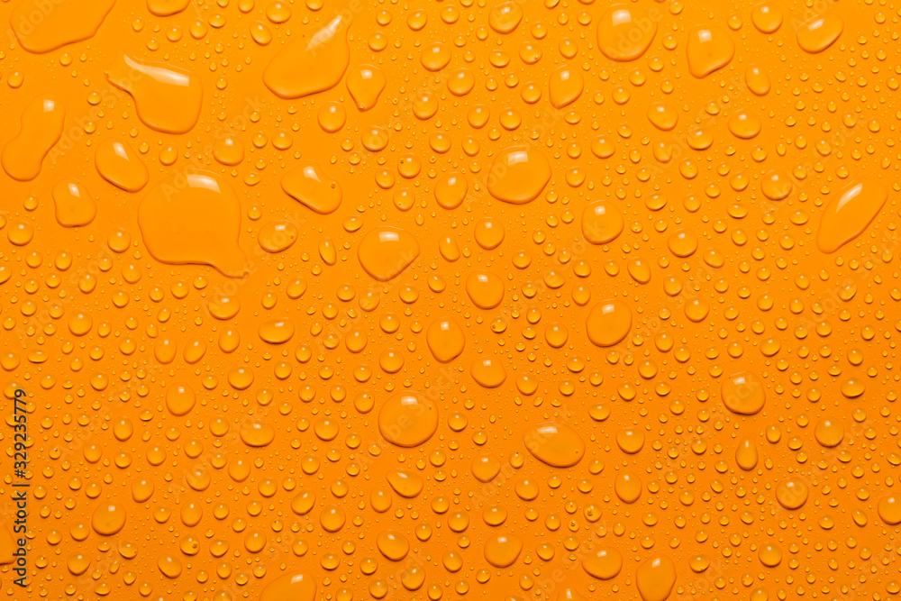 close-up water drop orange background close-up water drop orange background